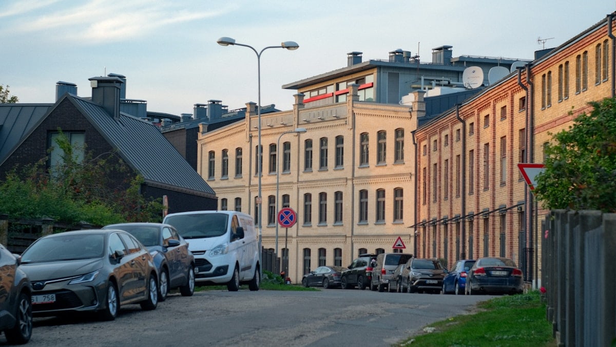 A bunch of cars parked on the side of a road